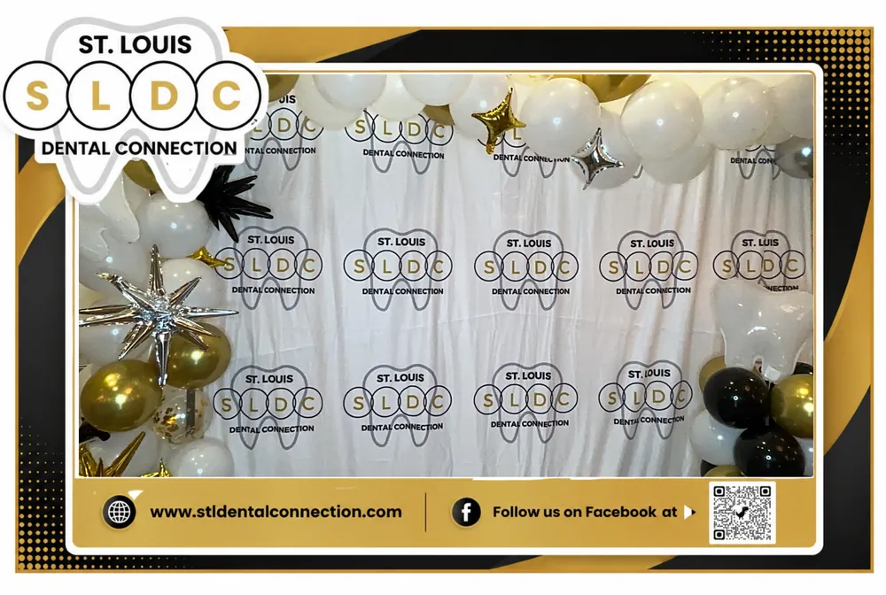 Branded corporate photo booth backdrop with balloons and a custom event overlay